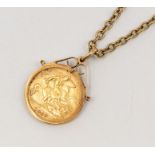 A Edward VII half sovereign, dated 1910, within a 9ct gold pendant mount, suspended from a yellow
