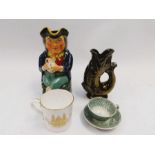 A novelty ceramic fish shaped handled jug, a toby jug, a Royal Worcester Prince Charles and Lady