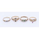 A collection of early 20th century gold rings to include an opal and emerald five stone 9ct gold