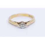 A diamond and 18ct gold solitaire ring, comprising a claw set round brilliant cut diamond approx 0.