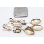 A collection of silver spoons to include; Three silver serving spoons: A pair of Victorian fiddle
