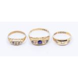 A collection of three early 20th century 18ct gold stone set rings to include a sapphire and diamond
