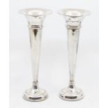 A pair of weighted silver posy vases with thin stem and trumpet form, fabric based, hallmarked