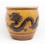 A Chinese glazed earthenware five clawed designed egg pot with brown banded decoration to sides,