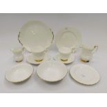 A large quantity of Royal Albert tea and coffee wares, white and gold pattern