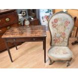 An early George III dark slender ladies writing desk with a slim top drawer and set on long
