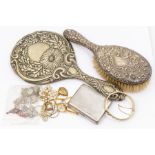 A collection of items to include a silver mounted hairbrush, Birmingham 1921, folitae decoration,