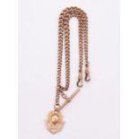 A 9ct rose gold double graduated Albert link fob chain, swivel clasps and T bar, links stamped 9