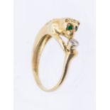 A diamond and 18ct gold ring in the form of a panther, the eyes set with emeralds, the body grain