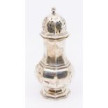 A George V silver baluster shaped octagonal caster, domed pieced cover, hallmarked by Edward