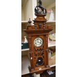 19th century German mahogany 8-day wall clock with Roman numerals and a horse finial detail