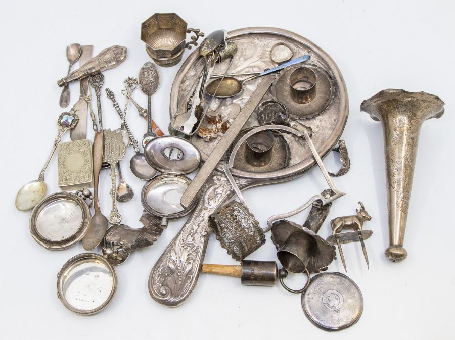 A collection of silver to include: Mostly broken or missing parts, including one silver mirror back,