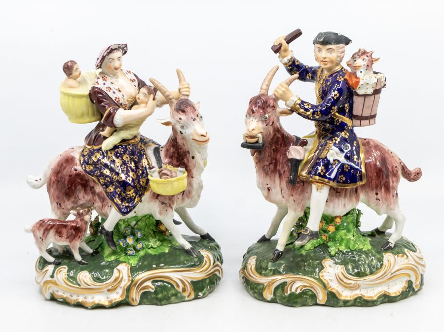 A pair of 19th Century Bloor Derby figures of the Welch Tailor and his Wife, both astride goats, she