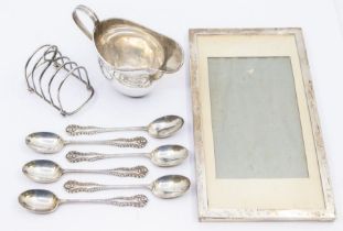 A collection of silver to include; a plain silver helmet jug, hallmarked Chester 1904 by Nathan