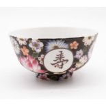 A Chinese 'millefleur' porcelain bowl, early 20th century, with four circular reserves enclosing
