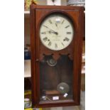 An American wall clock retailed by R H Turner of Ilkeston Derbyshire. With 8" white dial