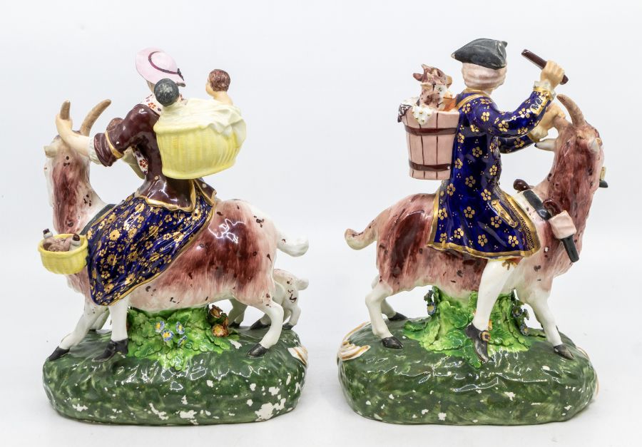 A pair of 19th Century Bloor Derby figures of the Welch Tailor and his Wife, both astride goats, she - Image 2 of 4