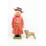 Composite Beefeater Pig along with brass bulldog