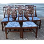 Ten mahogany reproduction George III dining chairs with blue padded seats.