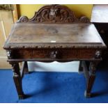 *Item to be collected from Friargate, Derby* A Victorian oak side table, the galleried back carved
