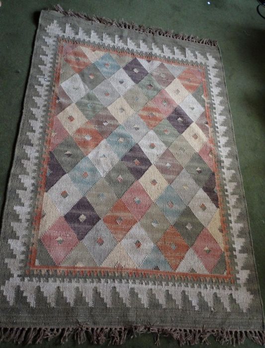 *Item to be collected from Friargate, Derby* A woollen rug in tones of green, blue, orange, pink