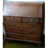*Item to be collected from Friargate, Derby* A George III oak bureau, the hinged flap opening to