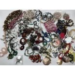 A large selection of costume jewellery to include pearl,shell and hardstone pieces, to include a