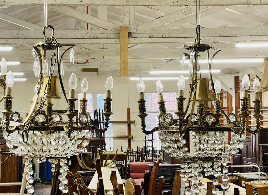 A pair of 20th century gilt metal chandeliers, french empire manner, cut glass droplets (2)