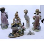 A group of LLadro figures, all in good condition to include a small lamb and one of a kitten staring