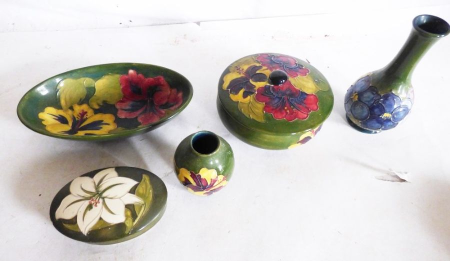 Moorcroft collection to include 2 lidded dishes , underside rim of lid on larger dish is chipped , 2