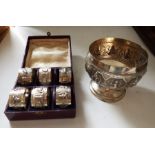 A set of 6 white metal Indian silver boxed ? napkin rings and a similar Indian White metal challis