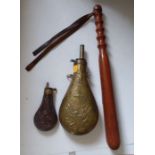 An American "Peace" pattern brass powder flask, another smaller powder flask and a turned wood