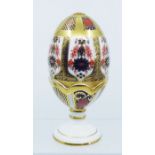 A collection of Royal Crown Derby Pattern 1128 Old Imari , to include a large goose egg with gold