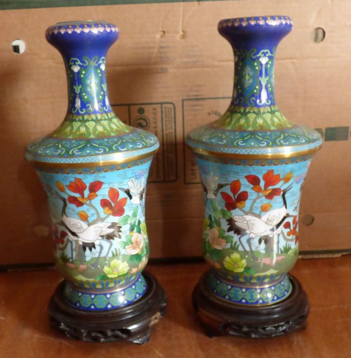 A group lot to include a pair of Cloisonné vases and a similar fruit bowl, all with wooden