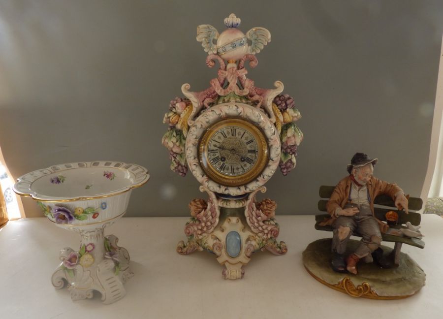 A tall German ceramic clock 46cm high, one foot has been repaired, A Naples ( Capodimonte) large