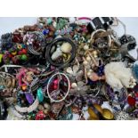 A bag containing a large quantity of costume jewellery, largely bracelets and bangles to include