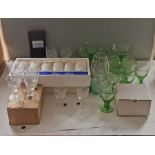 A quantity of glass ware to include various sets of glasses, a Tiffany crystal carafe, glass vases