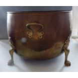 A brass twin-handled log bin on paw feet, 40cm x 53cm