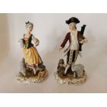 A pair of early 20th continental porcelain figures of a shepherd and shepherdess, impressed marks