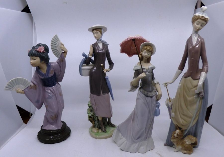 A group of LLadro figures all in good condition, The pink umbrella does detach, the tallest figure