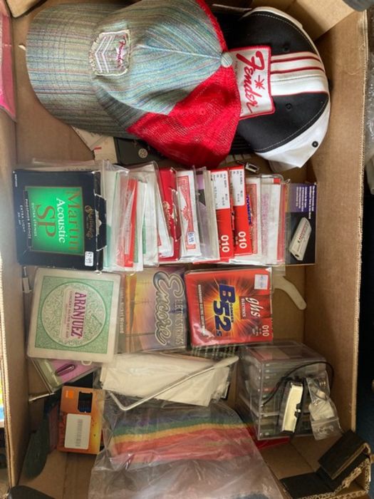 1 box with approximately 25 sets and some singles, electric and acoustic replacement guitar strings.