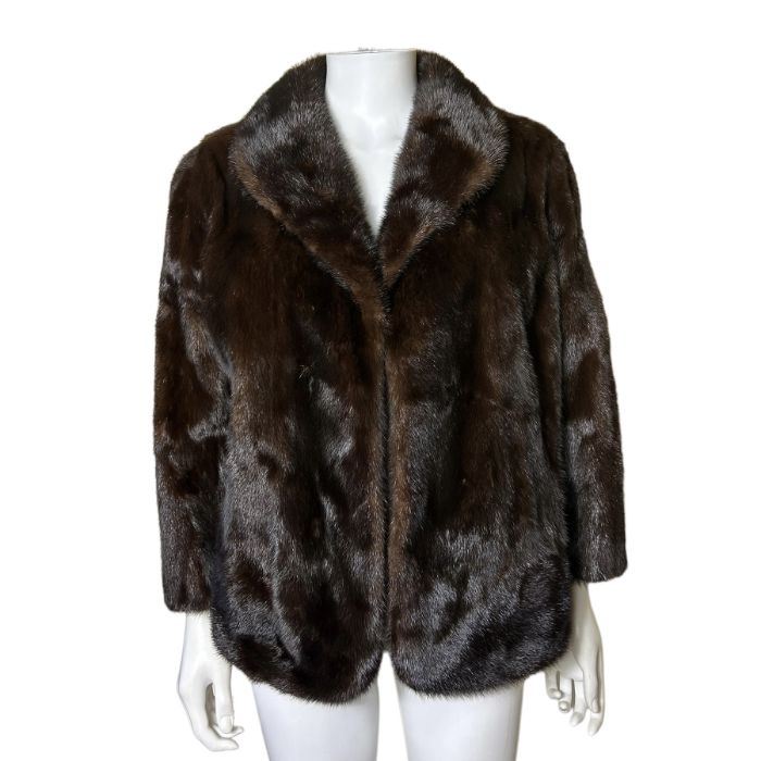 A vintage chocolate mink jacket with chocolate lining. good condition. no splits or balding. 45