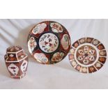 A large charger measuring 34cm across, a plate and a ginger jar standing 19cm high in the Imari