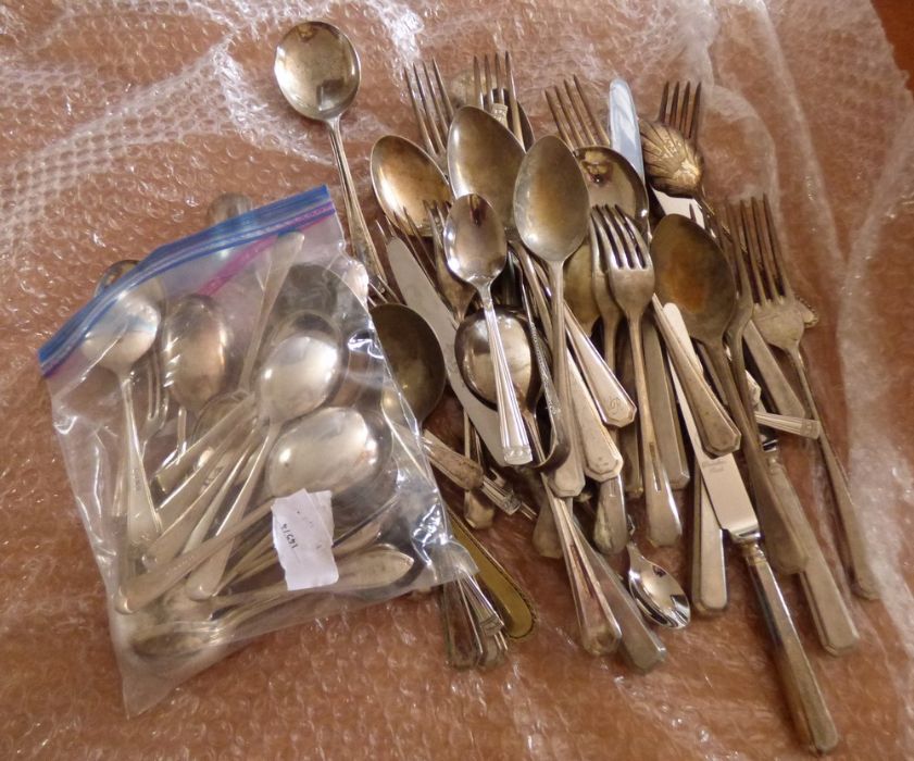 Large lot of plated table ware, to include knives, forks, spoons, fruit spoons sugar tongues etc