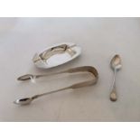 A sterling silver ashtray, Georgian sugar tongs and bright cut teaspoon total 3ozt.