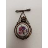 A French filigree white metal cased glass miniature brooch scent bottle, with a hand painted