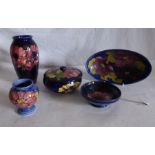 A collection of Moorcroft to comprise of Lidded dish, a pin dish , 2 vases and an oval shaped dish