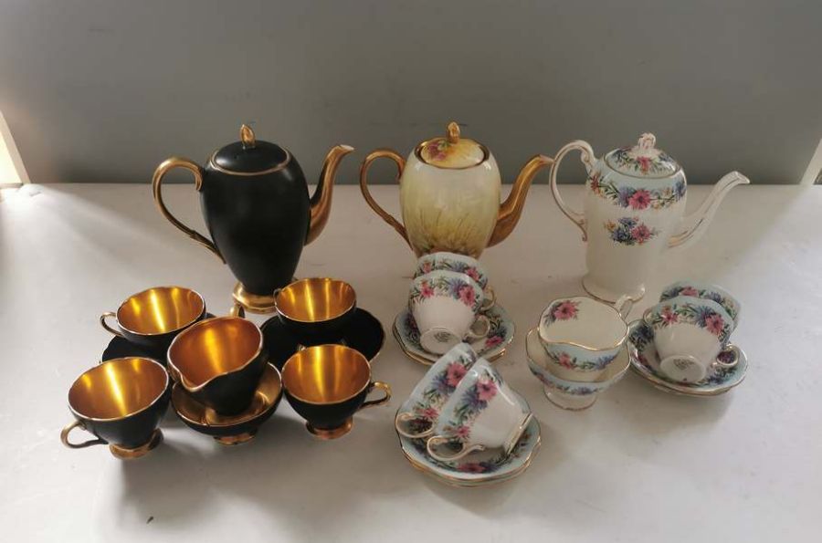 Quantity of Foley china coffee sets to include; black and gilt part service, Cornflower pattern 6