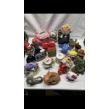 Extensive collection of China, stone ware, plastic and metal money boxes in 12 trays. includes