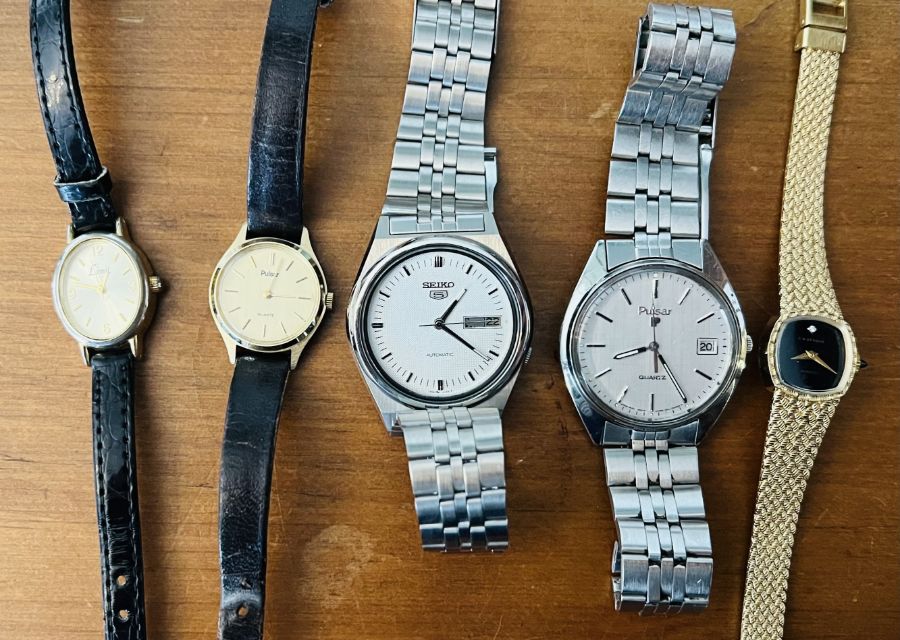 A selection of five automatic wristwatches comprising a gentleman's Pulsar stainless steel watch,